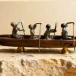 sculpture métal barque quatre rameurs