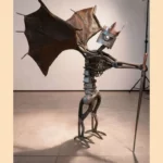 Sculpture chevalier dragon en métal recyclé avec armure et créature fantastique